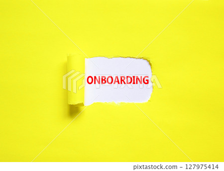 Onboarding success symbol. Concept word Onboarding on beautiful white paper. Beautiful yellow paper background. Business onboarding success concept. Copy space. 127975414