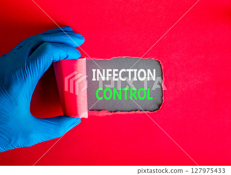 Infection control symbol. Concept words Infection control on beautiful grey paper. Doctor hand in blue medical glove. Beautiful red background. Medical healthy lifestyle infection control concept. 127975433