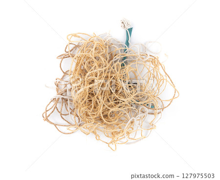 String piece isolated, jute rope fragment, part of packaging cord knots, eco-friendly natural rope 127975503