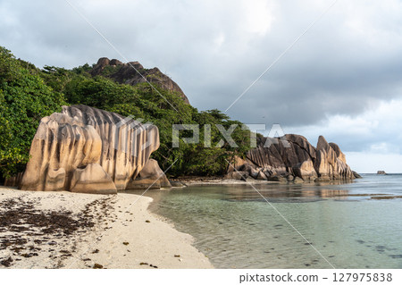 Granite rock formations along the shoreline of Anse Source d'Argent, La Digue Granite rock formations along the shoreline of Anse Source d'Argent, La Digue 127975838