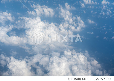 Blue Sky with White Clouds, Flying above Sunny Cloudy Sky Texture Pattern Plane View Blue Sky with White Clouds, Flying above Sunny Cloudy Sky Texture Pattern Plane View 127975928