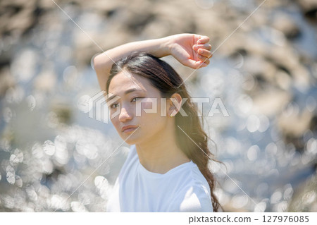 Young woman relaxing by the river 127976085