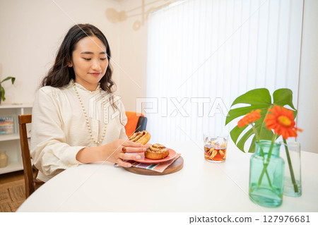 A woman eating breakfast A woman eating breakfast 127976681