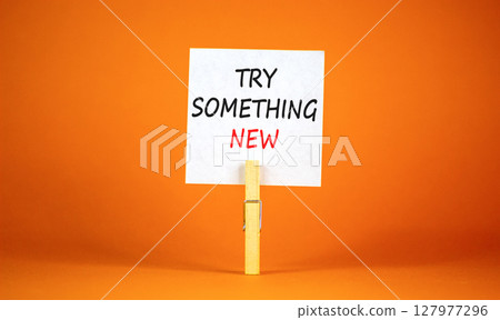 Try something new symbol. Concept words Try something new on beautiful white paper on clothespin. Beautiful orange background. Business motivational lifestyle try something new concept. Copy space. Try something new symbol. Concept words Try something new on beautiful white paper on clothespin. Beautiful orange background. Business motivational lifestyle try something new concept. Copy space. 127977296