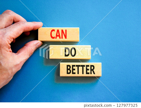 Can do better symbol. Concept words Can do better on beautiful wooden block. Businessman's hand. Beautiful blue background. Business and can do better concept. Copy space. Can do better symbol. Concept words Can do better on beautiful wooden block. Businessman's hand. Beautiful blue background. Business and can do better concept. Copy space. 127977325