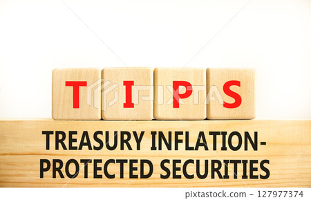 TIPS symbol. Concept word TIPS Treasury Inflation Protected Securities on beautiful blocks. Beautiful white background. Business TIPS Treasury Inflation Protected Securities concept. Copy space. TIPS symbol. Concept word TIPS Treasury Inflation Protected Securities on beautiful blocks. Beautiful white background. Business TIPS Treasury Inflation Protected Securities concept. Copy space. 127977374