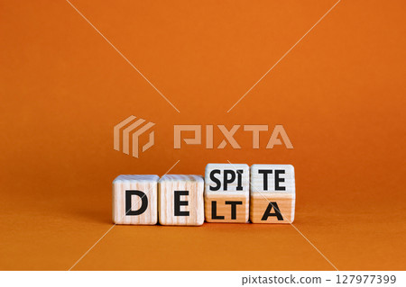 Covid-19 delta variant strain despite symbol. Turned wooden cubes and changed the word delta to despite. Beautiful orange background. Covid-19 delta variant strain defence concept. Copy space. Covid-19 delta variant strain despite symbol. Turned wooden cubes and changed the word delta to despite. Beautiful orange background. Covid-19 delta variant strain defence concept. Copy space. 127977399