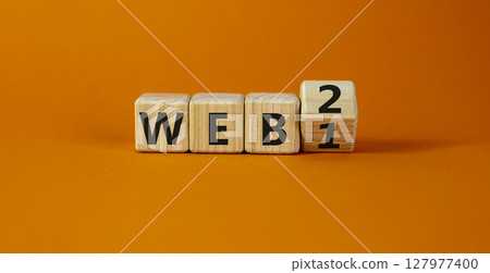 WEB 1 or 2 symbol. Turned a wooden cube and changed words WEB 1 to WEB 2. Beautiful orange table, orange background, copy space. Business, technology and WEB 1 or 2 concept. WEB 1 or 2 symbol. Turned a wooden cube and changed words WEB 1 to WEB 2. Beautiful orange table, orange background, copy space. Business, technology and WEB 1 or 2 concept. 127977400