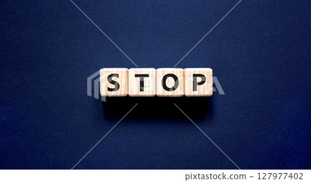 Stop symbol. Concept word Stop on beautiful wooden blocks. Beautiful black table black background. Business, lifestyle, support and stop concept. Copy space. 127977402