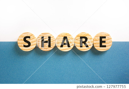 Share symbol. Concept word Share on beautiful wooden circles. Beautiful white and blue background. Business lifestyle share concept. Copy space. 127977755