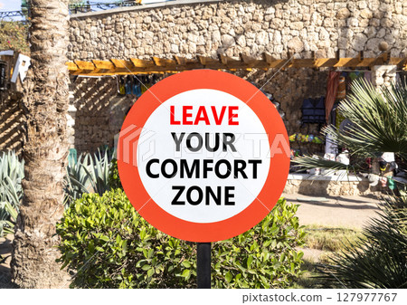 Leave your comfort zone symbol. Concept words Leave your comfort zone on beautiful road sign. Beautiful palm tree background. Business psychological Leave your comfort zone concept. Copy space. Leave your comfort zone symbol. Concept words Leave your comfort zone on beautiful road sign. Beautiful palm tree background. Business psychological Leave your comfort zone concept. Copy space. 127977767