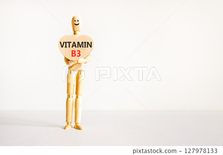 Vitamin B3 niacin symbol. Concept words Vitamin B3 on beautiful wooden heart. Doctor's model. Beautiful white background. Copy space. Medical healthy lifestyle Vitamin B3 niacin concept. 127978133
