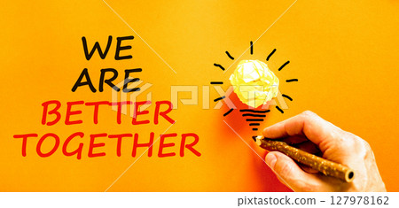 We are better together symbol. Concept words phrase We are better together on beautiful orange paper. Businessman's hand. Beautiful orange background Business We are better together concept Copy space We are better together symbol. Concept words phrase We are better together on beautiful orange paper. Businessman's hand. Beautiful orange background Business We are better together concept Copy space 127978162