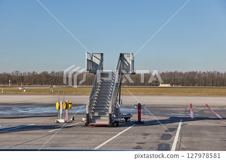 Airplane ground handling stairs standing unused, empty 127978581