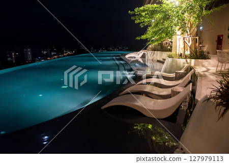 Skylounge 360 swimming pool light up on rooftop at night 127979113