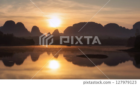 Beautiful sunrise view of lake and karst mountain in Nong Thale, Krabi Beautiful sunrise view of lake and karst mountain in Nong Thale, Krabi 127979123