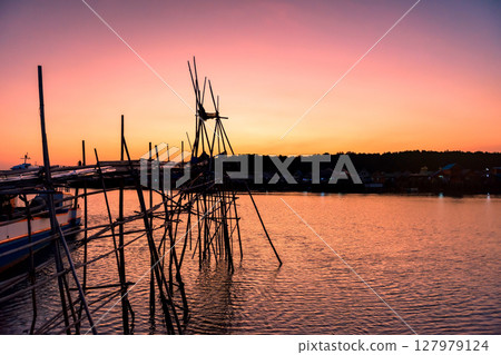 Silhouette wood fishing by boat at sunset, Phang Nga, Thailand 127979124
