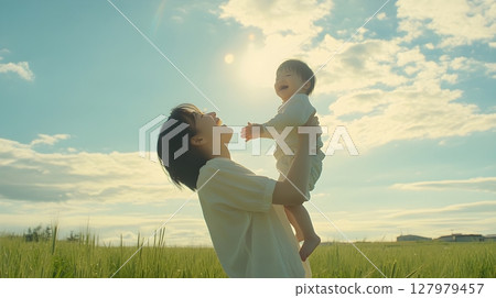 happy mother and baby in field happy mother and baby in field 127979457