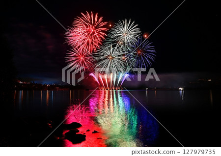 Beautiful colorful fireworks with reflections in water. Brno dam, the city of Brno-Europe. International Fireworks Competition. 127979735