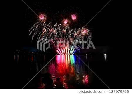 Beautiful colorful fireworks with reflections in water. Brno dam, the city of Brno-Europe. International Fireworks Competition. Beautiful colorful fireworks with reflections in water. Brno dam, the city of Brno-Europe. International Fireworks Competition. 127979736