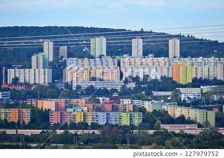 Original prefabricated houses on a housing estate from the communist era in Eastern and Central Europe after reconstruction.. Facade of a modern apartment building with windows and balconies. Czech 127979752