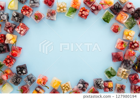 Frame of ice cubes with frozen berries Frame of ice cubes with frozen berries 127980194