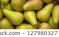 Lots of yellow pears in the supermarket. Storage of pears. Selling pears. 127980327