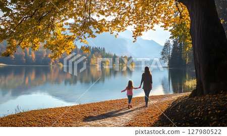 Autumn stroll by the lake with loved ones. 127980522