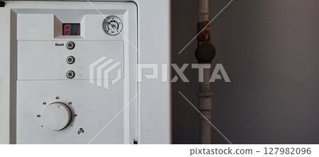 Gas Boiler Control Panel with Error Code E1. Heating System Maintenance, Utility Technology, Home Appliance Gas Boiler Control Panel with Error Code E1. Heating System Maintenance, Utility Technology, Home Appliance 127982096