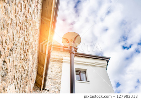 thick walls and blue sky at Castle. Ancient medieval castle palace thick walls and blue sky at Castle. Ancient medieval castle palace 127982318