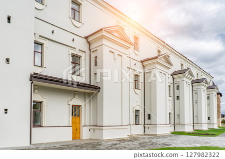 Detail of modern residential flat apartment building exterior. Fragment of new luxury house and home complex. Yellow sunlight. Black and white. Detail of modern residential flat apartment building exterior. Fragment of new luxury house and home complex. Yellow sunlight. Black and white. 127982322