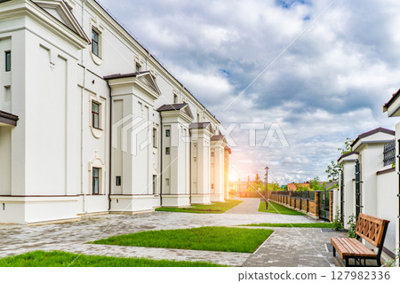 Scenic view of medieval castle in sun light. Beautiful sunny scenery in evening. Scenic view of medieval castle in sun light. Beautiful sunny scenery in evening. 127982336