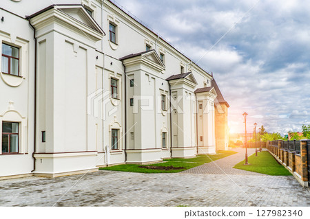 Scenic view of medieval castle in sun light. Beautiful sunny scenery in evening. Scenic view of medieval castle in sun light. Beautiful sunny scenery in evening. 127982340