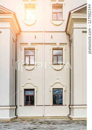 Modern buildings with big glass windows black and white small trees, good neighborhood, modern city, suburb. 127982344