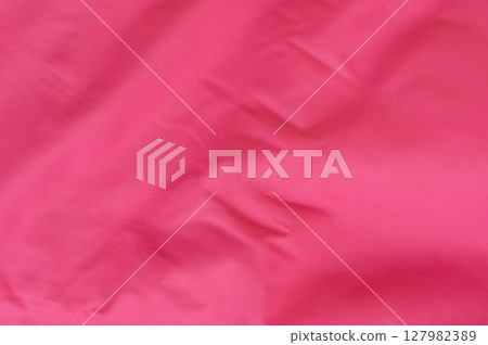 Bright pink fabric showcasing texture and detail in casual setting 127982389