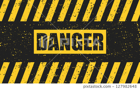 Abstract grunge yellow danger sign on a black background. 127982648