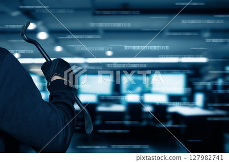 Intruder with a crowbar in a dark office space 127982741