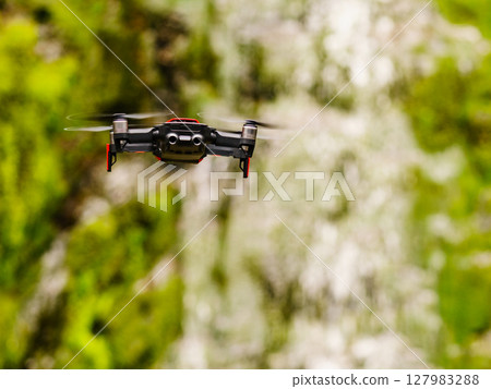 Drone flying against norwegian nature Drone flying against norwegian nature 127983288