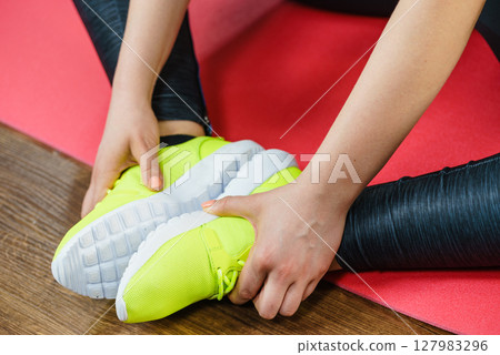 Woman wearing sportswear trainers shoes 127983296