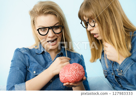 Two crazy women friends thinking 127983333