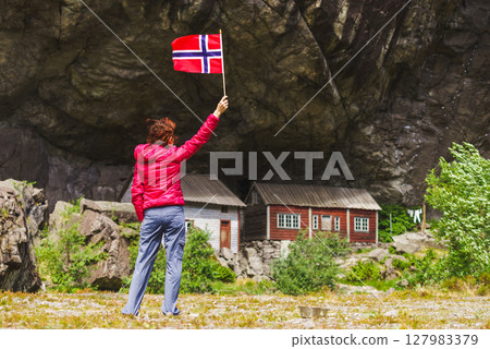 Tourist visiting Helleren houses in Jossingfjord, Norway 127983379