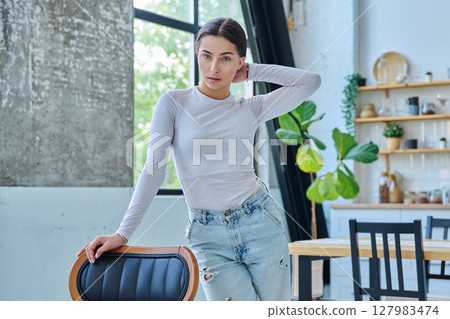 Portrait of beautiful stylish young teenage girl posing at home Portrait of beautiful stylish young teenage girl posing at home 127983474