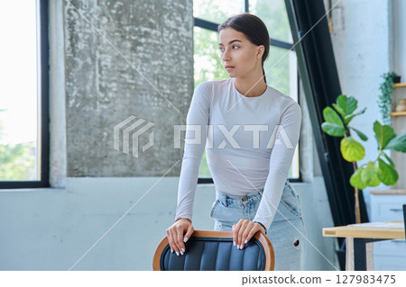 Portrait of beautiful stylish young teenage girl posing at home 127983475