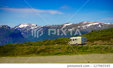 Camper car on road in norwegian mountains Camper car on road in norwegian mountains 127983585