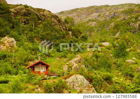 Norwegian country house in mountains. Norwegian country house in mountains. 127983588