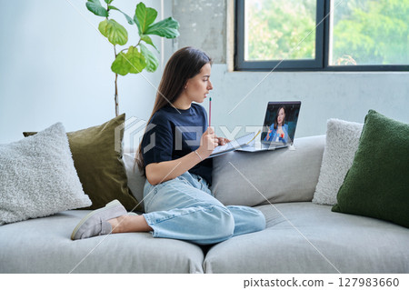 Teenage girl student having online lesson, watching webinar, at home 127983660