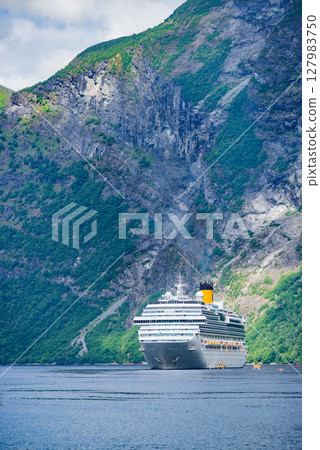 Ferry boat on fjord in Norway. 127983750