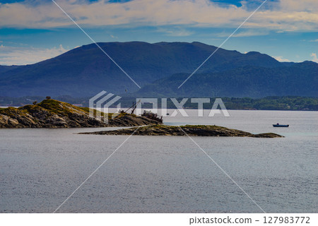 Norwegian coastline with fishing boats Norwegian coastline with fishing boats 127983772