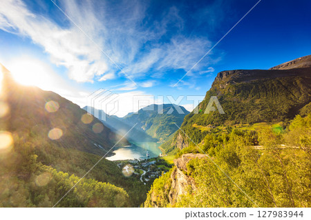 Cruise ship on Geiranger fjord at sunset Norway. Cruise ship on Geiranger fjord at sunset Norway. 127983944