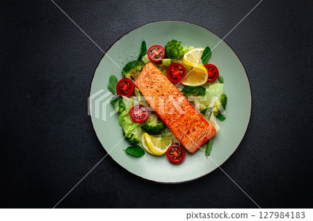 grilled salmon fillet, with vegetables, broccoli, cherry, iceberg lettuce, spices and herbs, homemade, no people, 127984183